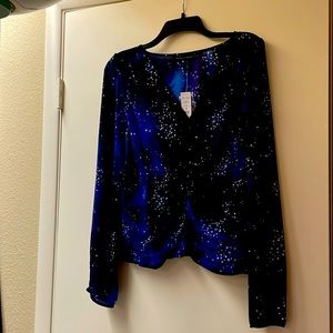 Beautiful star top with V neck front. Never worn